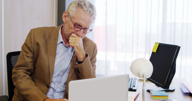 Senior Businessman Working and Thinking at Office Desk - Download Free Stock Images Pikwizard.com