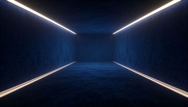 Glowing navy corridor leading to vanishing point with led edge lights and deep perspective