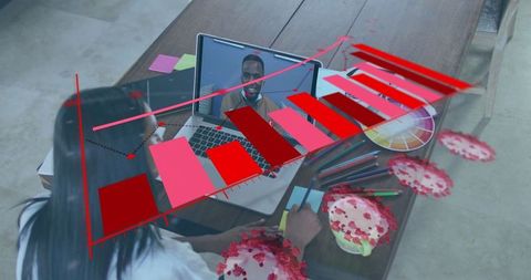 Young woman collaborating with virtual infographic on laptop