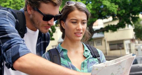 Young Motivated Couple Getting City Directions from Map - Download Free Stock Images Pikwizard.com