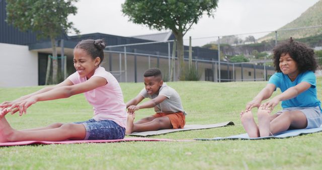 Children Stretching Outside on Yoga Mats in Park - Download Free Stock Images Pikwizard.com