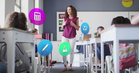 Female teacher engaging diverse classroom with education icons