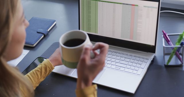 Professional Working on Spreadsheet with Coffee at Desk - Download Free Stock Images Pikwizard.com