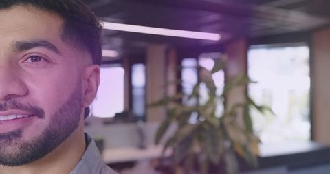 Professional Man in Modern Open-Plan Office