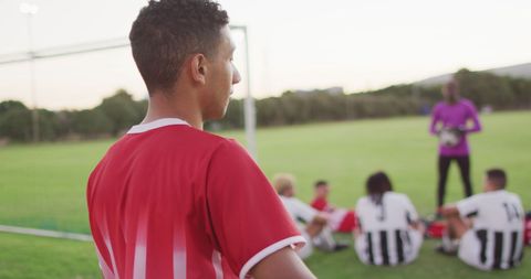 Young Football Player Stands Ready on Soccer Field - Download Free Stock Images Pikwizard.com