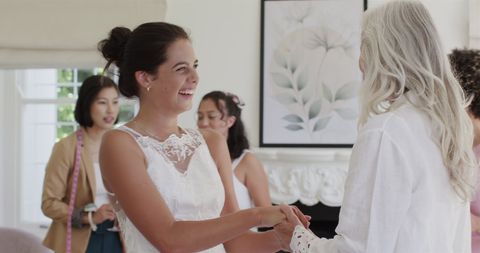 Joyful Bride Celebrating with Friends Before Wedding Ceremony