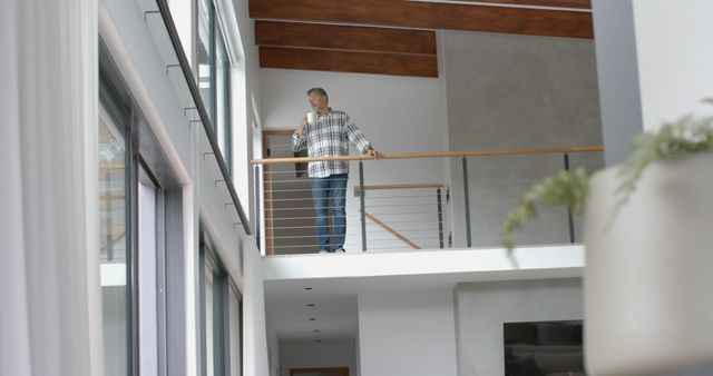 Mature Man Relaxing on Balcony with Coffee in Modern Home Interior - Download Free Stock Images Pikwizard.com