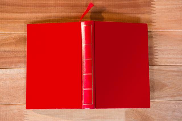 Open Red Book Upside Down on Wooden Table - Download Free Stock Photos Pikwizard.com