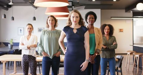 Confident Female Business Team Posing in Modern Office