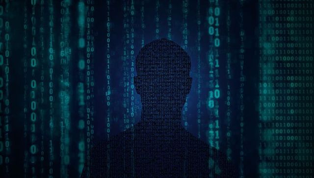 Silhouette Filled with Binary Code Amid Neon Matrix Streams Conveying Cyber Anonymity