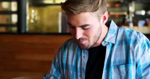 Young Man Eating in Modern Restaurant - Download Free Stock Images Pikwizard.com