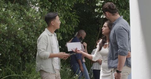 Guests celebrating at garden wedding reception