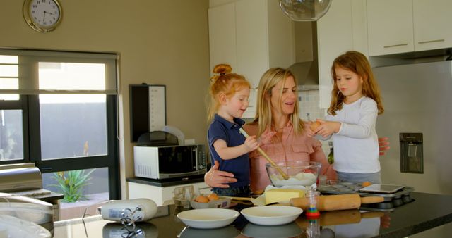 Mother Baking with Young Daughters in Modern Kitchen - Download Free Stock Images Pikwizard.com