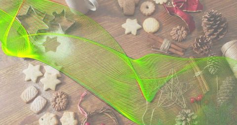 Neon green mesh sweeping over rustic holiday baking scene with star cookies and pine cones