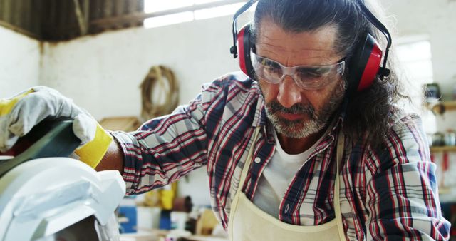 Carpenter Focused on Cutting Wood with Circular Saw - Download Free Stock Images Pikwizard.com