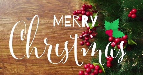 Merry Christmas Text with Berries and Fir on Rustic Wood - Download Free Stock Images Pikwizard.com