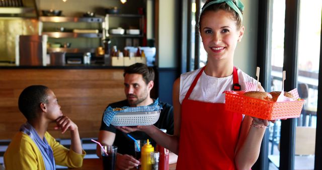 Smiling Waitress Serving Food to Customers in Cafe - Download Free Stock Images Pikwizard.com