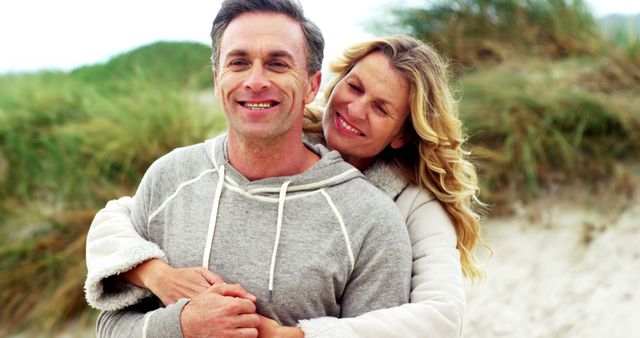 Happy Senior Couple Embracing Outdoors Beach Setting - Download Free Stock Images Pikwizard.com