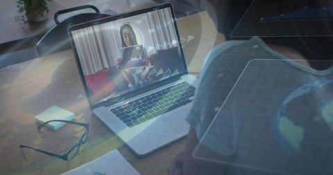 Remote collaboration on laptop during video call presenting chart with world map overlay