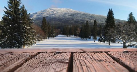 Winter Landscape with Snowy Mountain and Wooden Deck
