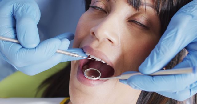 Dentist Performing Dental Checkup on Female Patient - Download Free Stock Images Pikwizard.com