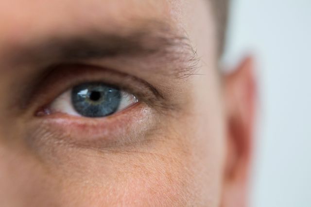 Close Up of Man's Blue Eye with Detailed Skin Texture - Download Free Stock Photos Pikwizard.com