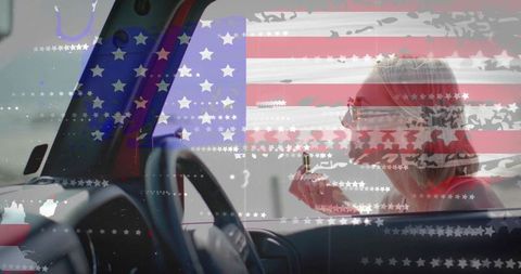 Patriotic woman applying lipstick inside car with american flag double exposure overlay