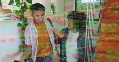 Young colleagues checking smartphone with stock market tickers overlay in bright entryway