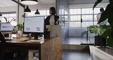 Businesswoman Analyzing Data in Modern Workspace