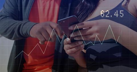 Collaborating on mobile data with hands pointing at smartphone and digital financial chart
