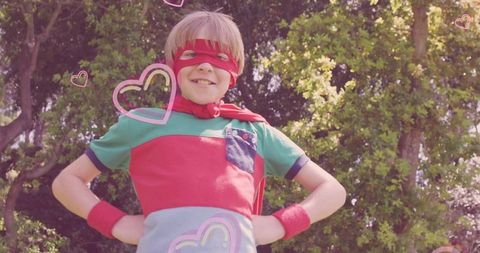 Young Superhero Stands Confident in Backyard Garden