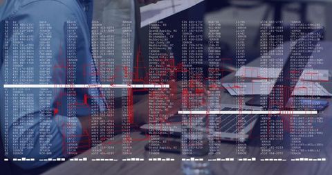 Colleagues Collaborating on Data Analysis with Technology in Modern Office