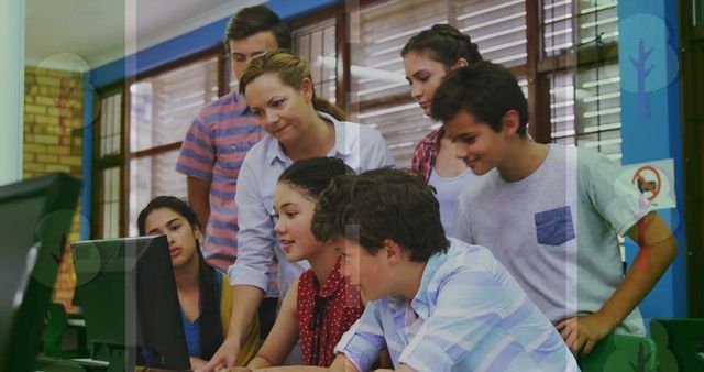 Dedicated Teacher Guiding Students in School Computer Lab