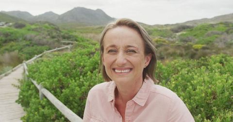 Smiling Senior Woman Enjoying a Nature Walk
