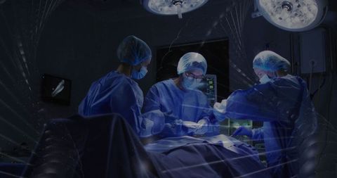 Surgical team in operating room performing medical procedure