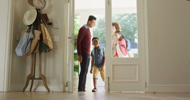 Happy african american family entering the house from front door. family, love and togetherness concept