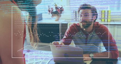 Team Collaboration in Modern Office with Desk Laptop and Code Projection