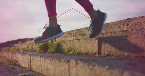 Athletic Woman Running Down Stone Steps for Fitness