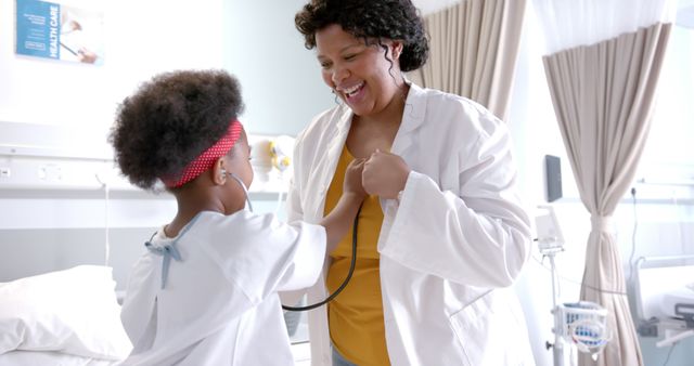 Playful Doctor Examining Young Girl with Stethoscope in Hospital Room - Download Free Stock Images Pikwizard.com