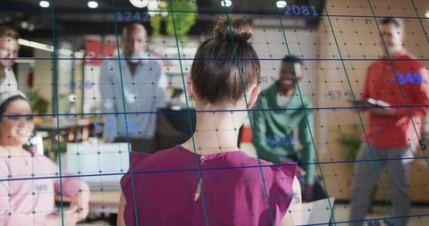 Presenting augmented reality data grid to team in modern open-plan workspace