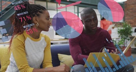 Diverse Team Analyzing Digital Reports in Modern Office Environment