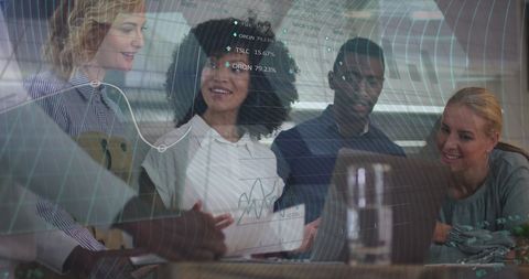 Diverse Colleagues Analyzing Data with Virtual Graphics in Modern Office