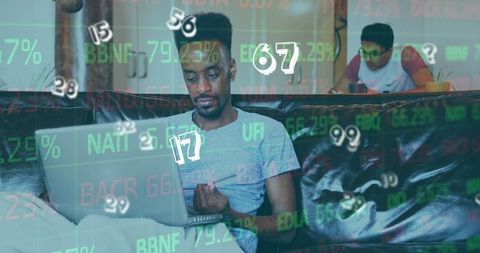 Man analyzing financial data on laptop with numbers overlays