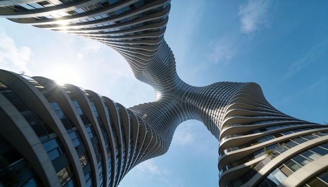 Twisting quad-tower converging skyscrapers with curved glass balconies, reflective steel