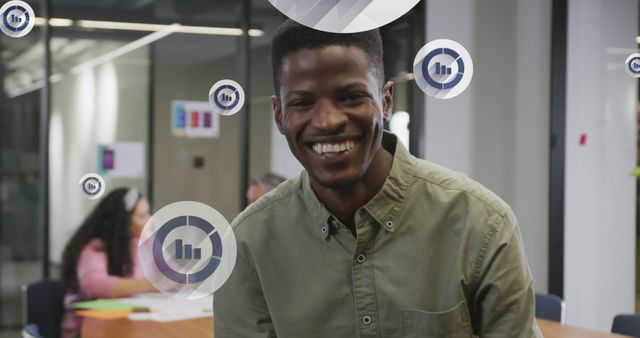 Smiling African American Man Working in Modern Office Environment - Download Free Stock Images Pikwizard.com