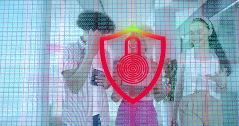 Business team collaborating on devices under digital shield protecting data and privacy