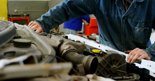 Auto Mechanic Repairing Car Engine in Garage - Download Free Stock Images Pikwizard.com