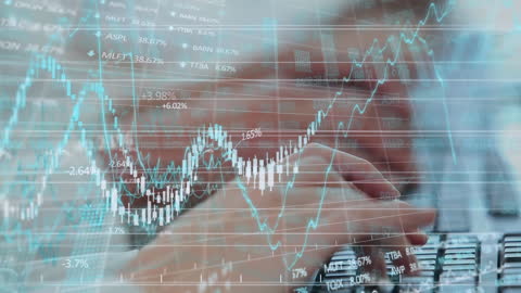 Businessman Analyzing Financial Data and Digital Graphs