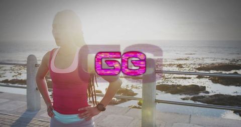 Active woman exercising on scenic coastal promenade