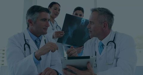Medical Team Analyzing Diagnostic Imaging with Modern Technology